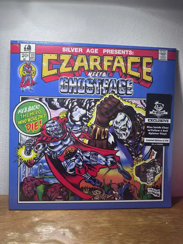 A comic book cover parody titled 'Silver Age Presents: Ezarface Meets Ghostface' depicts a silver-armored hero with a red…