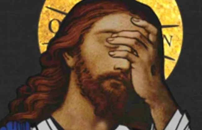 A classical religious painting of Jesus Christ with long brown hair and a beard, covering his face with his hand in a…