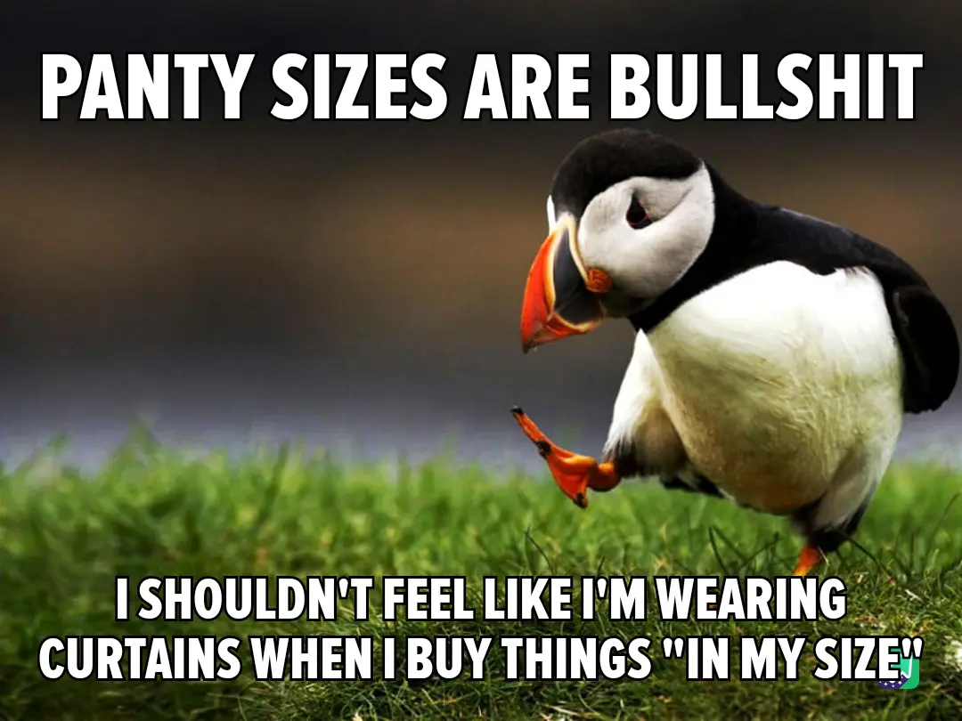 A photograph of a puffin standing on green grass with a blurred background, looking down with a skeptical expression. The…