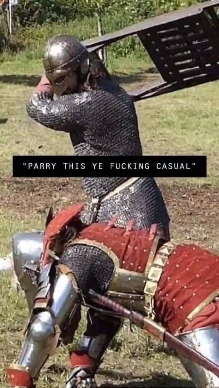 A person in full medieval armor, including chainmail and helmet, is shown in a defensive posture, holding a large wooden…