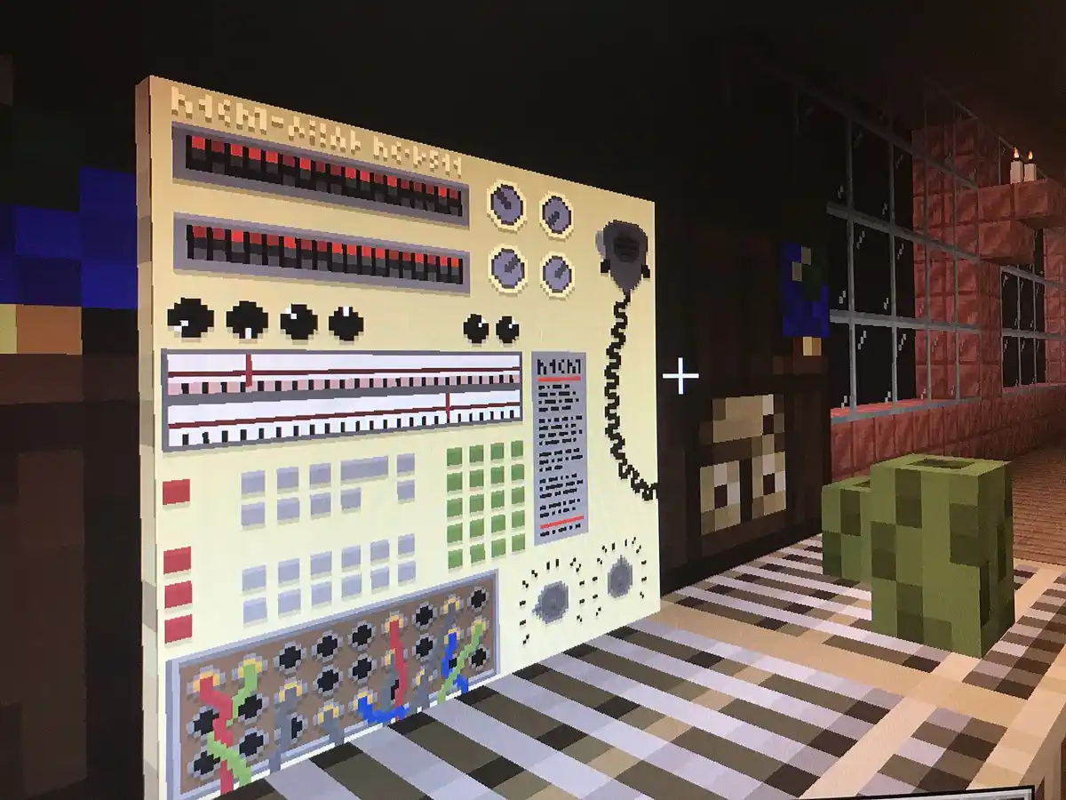 A Minecraft scene shows a large, pixelated control panel labeled 'high-kill boss' with dials, buttons, and a phone, next to…