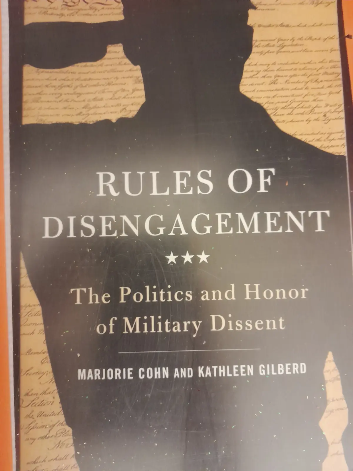 The image shows the cover of a book titled 'Rules of Disengagement: The Politics and Honor of Military Dissent' by Marjorie…