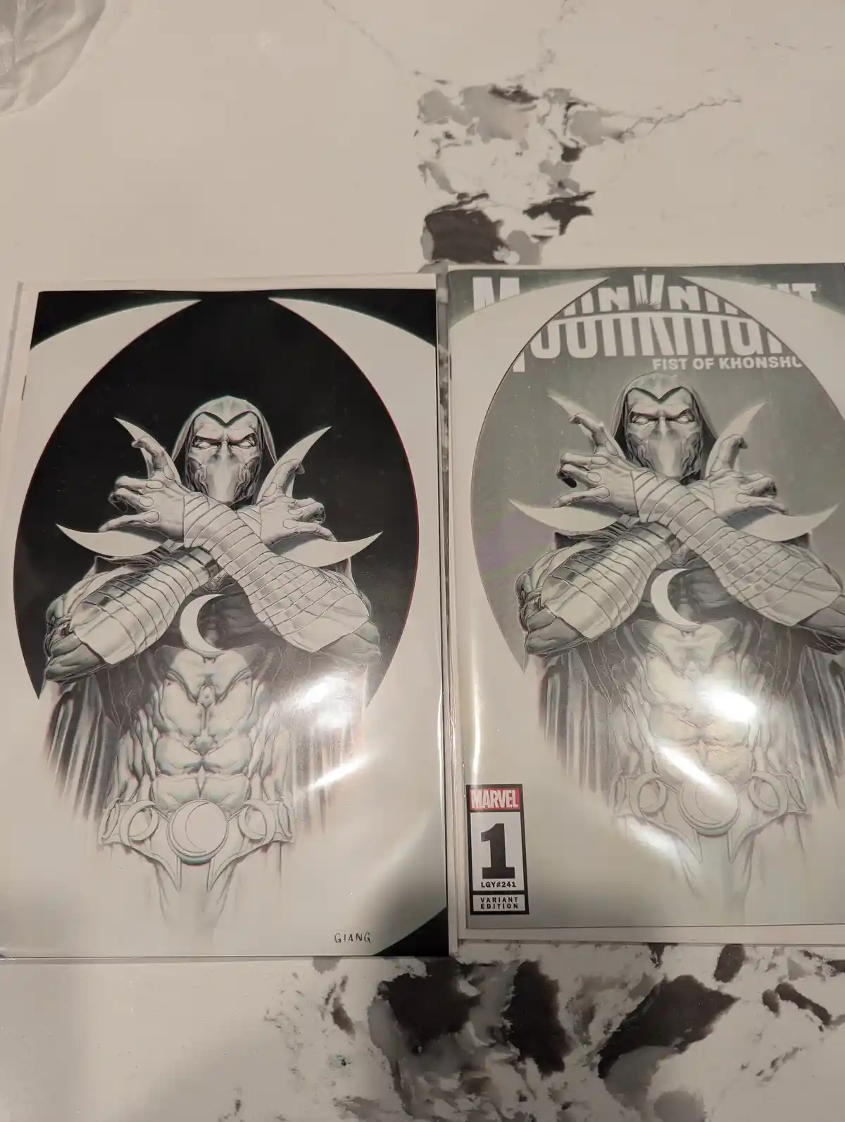 Two comic book covers of Moon Knight, both featuring the character in a similar pose with crossed arms and crescent moon…