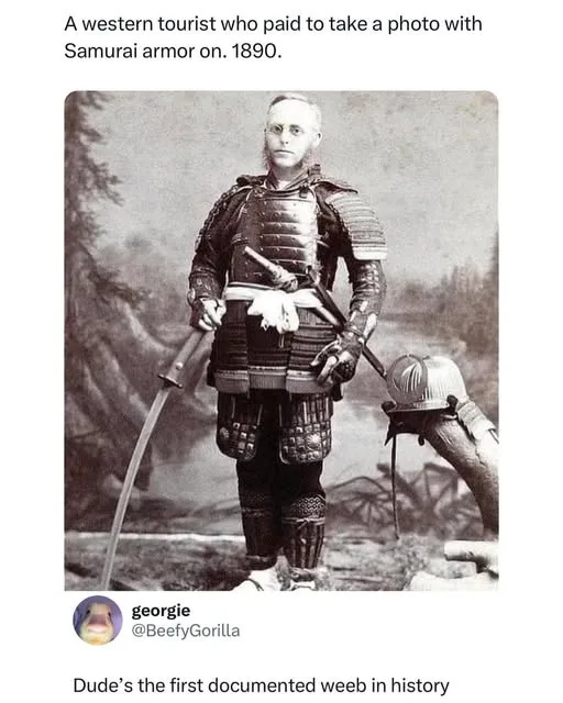 A sepia-toned historical photograph from 1890 shows a western man in full samurai armor, holding a sword and standing beside…