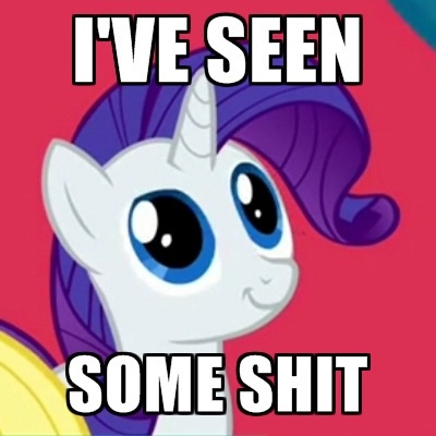 A close-up of the cartoon pony Rarity from My Little Pony, with large blue eyes and a purple mane, smiling slightly against…