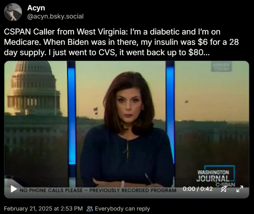 A screenshot from a CSPAN broadcast shows a female news anchor with arms crossed, looking serious, with the U.S. Capitol…