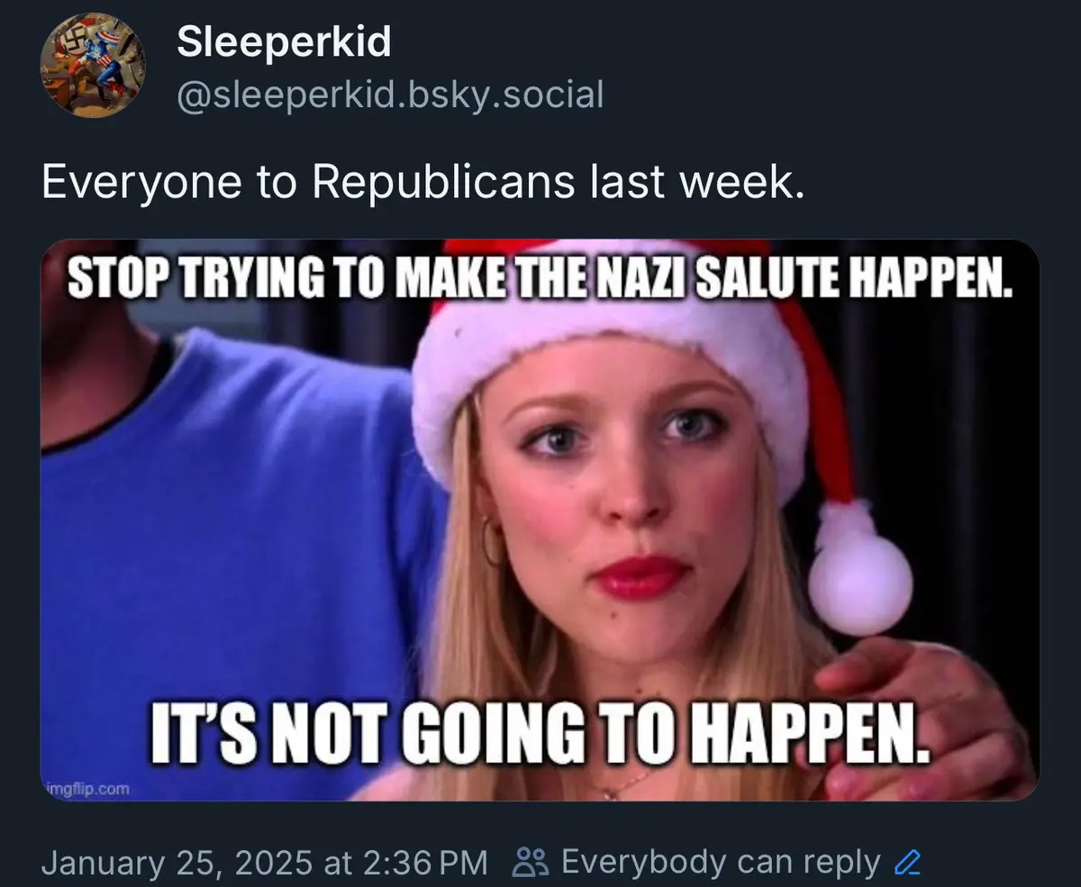 A screenshot of a social media post by 'Sleeperkid' featuring a woman wearing a Santa hat with a stern expression. The image…