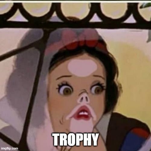 A close-up of Snow White from Disney's animated film, showing her with wide, shocked eyes and a gaping mouth, as if reacting…