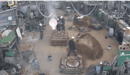 A sequence of images shows a factory worker walking toward a glowing lightbulb, which then explodes into a shower of sparks…