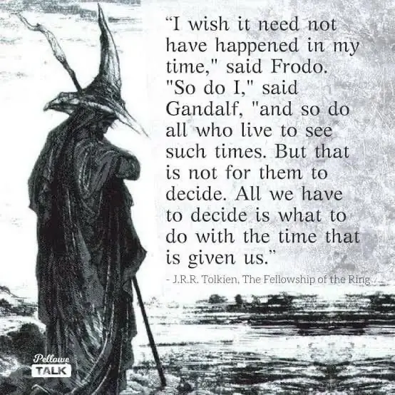 A black-and-white illustration shows a cloaked figure in a pointed wizard hat, holding a staff, standing on a rocky shore…