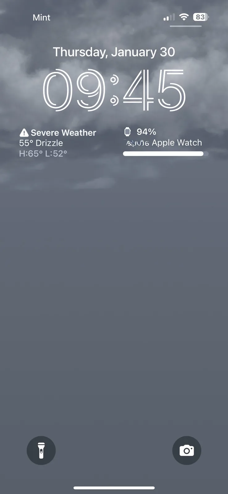 An iPhone lock screen shows a cloudy sky background with the time 09:45, date Thursday, January 30, and a severe weather…