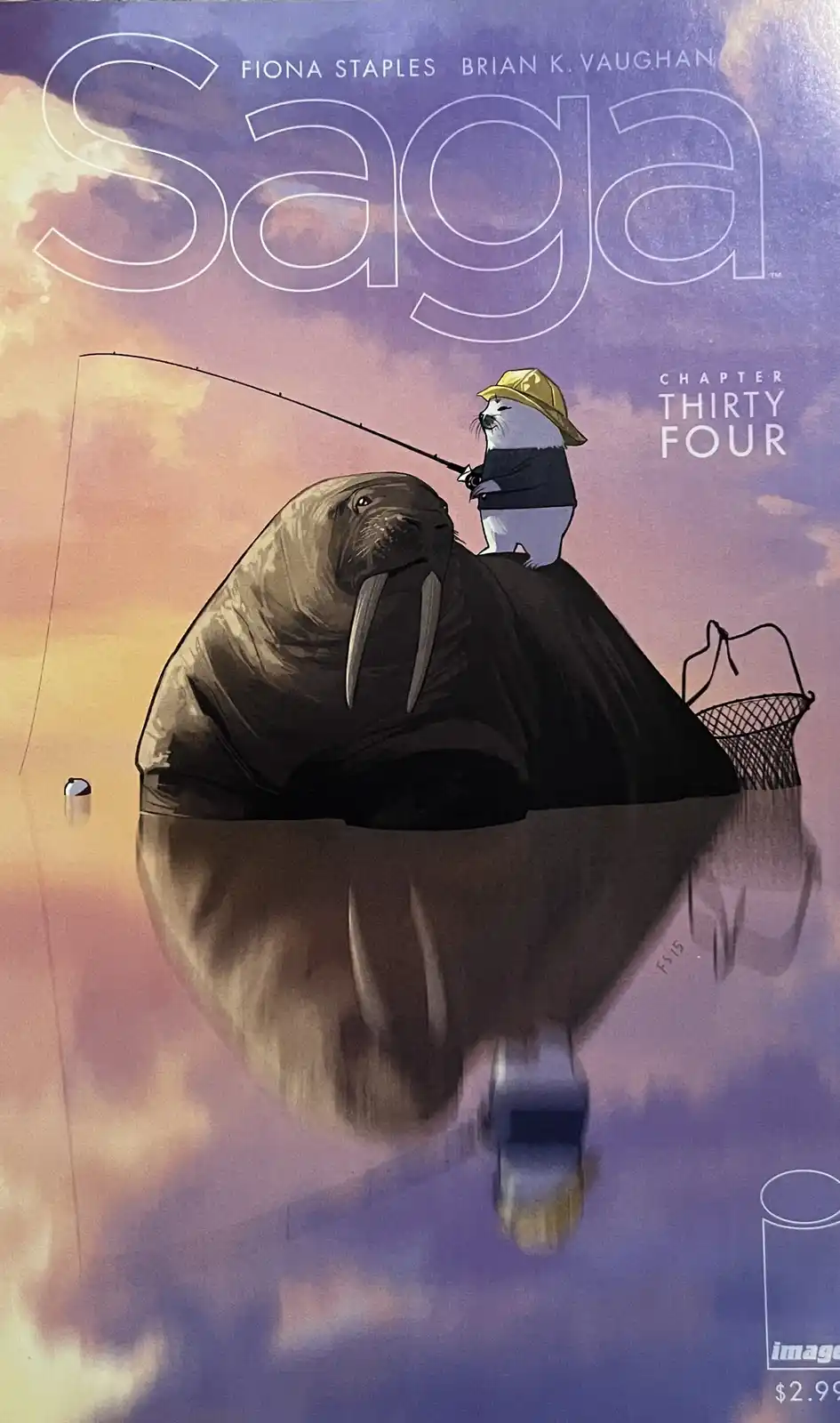 The image is a comic book cover for 'Saga' chapter thirty-four, showing a small white creature wearing a yellow hat and dark…