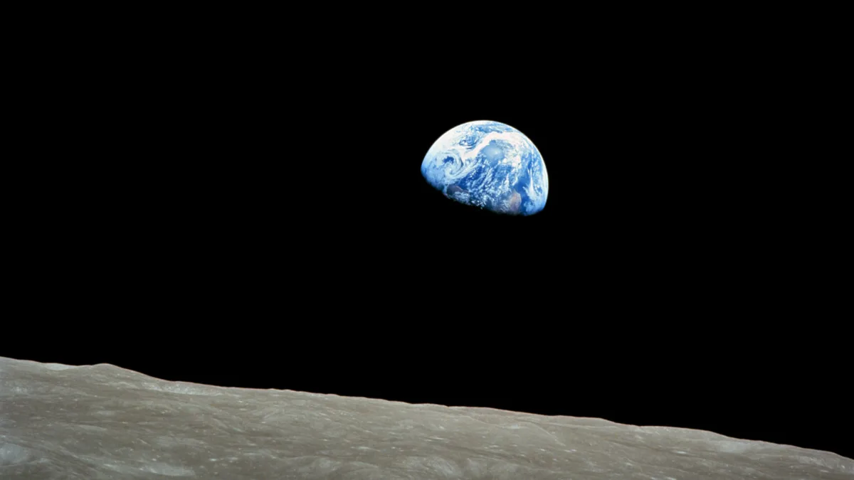 A famous photograph shows the Earth rising above the lunar horizon, with the planet's blue oceans and swirling white clouds…