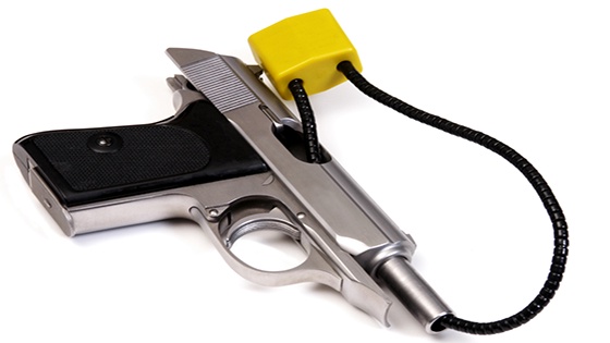 A silver semi-automatic pistol with a black grip is shown against a white background, secured by a bright yellow padlock…