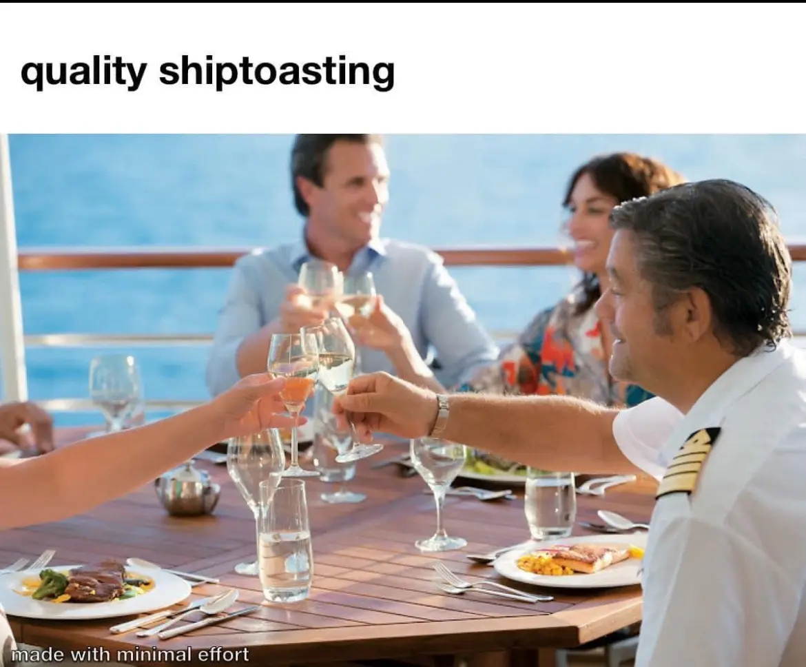 A group of people, including a ship captain in uniform, are toasting with wine glasses at an outdoor dining table on a boat…