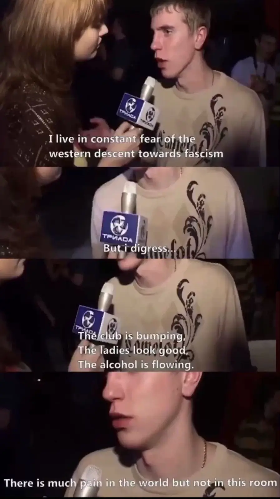 A man in a beige t-shirt is being interviewed in a dimly lit club by a woman holding a microphone with a 'ТРИАДА' logo. The…