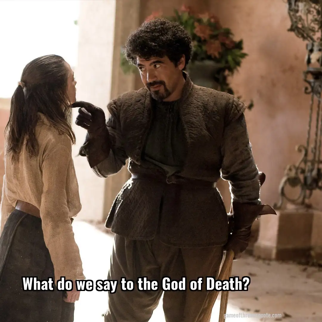 A man with curly hair and a beard, dressed in medieval-style clothing, points his gloved finger at a woman with long hair…