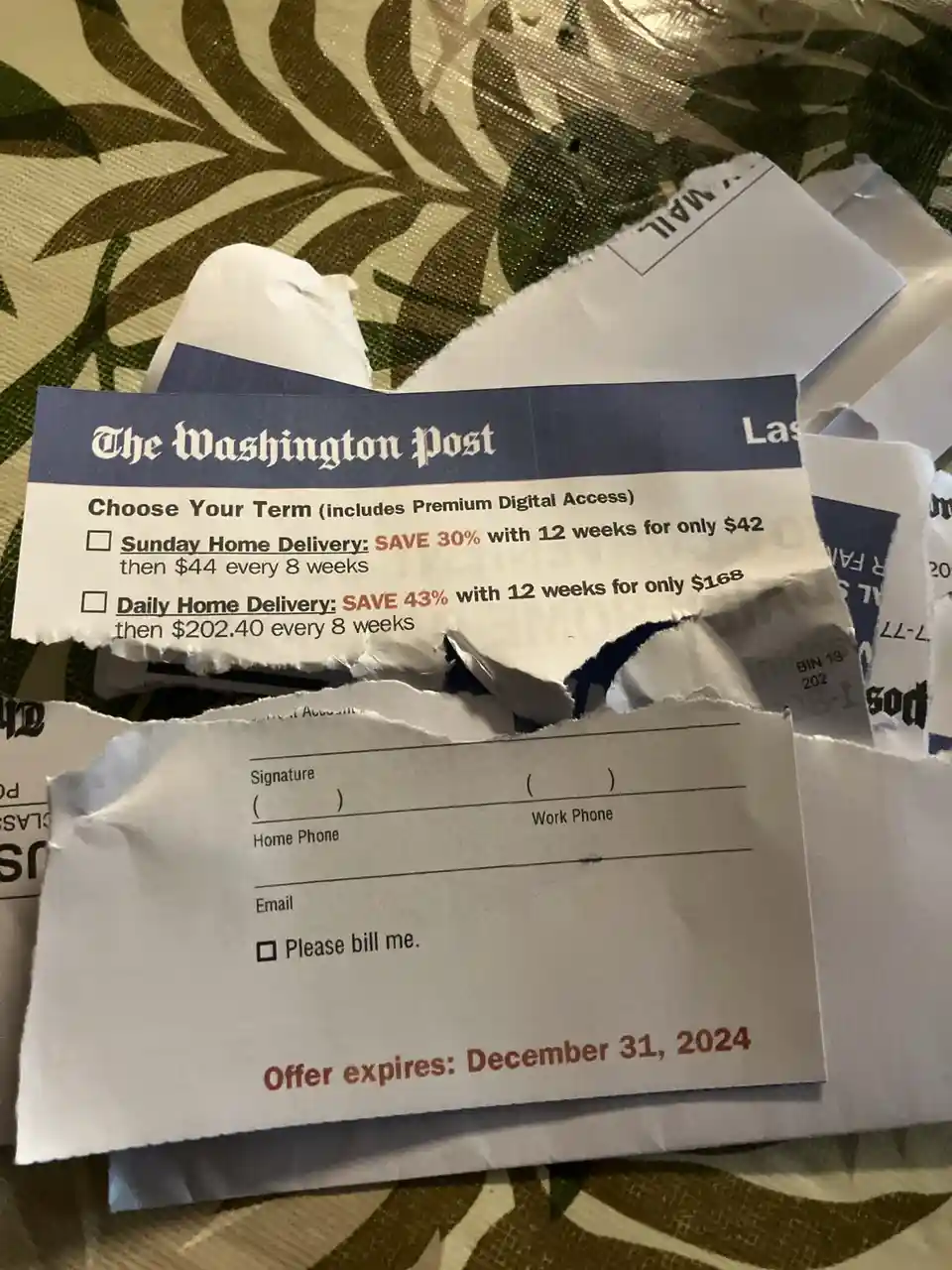A torn Washington Post subscription offer form is shown, with visible pricing options for Sunday and Daily Home Delivery…