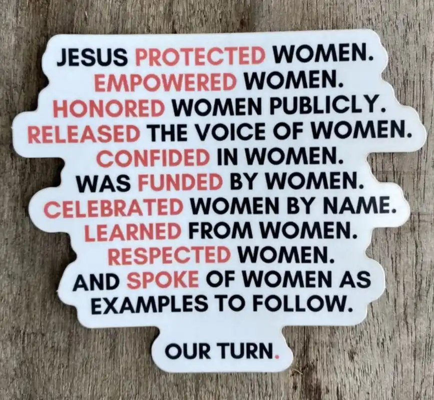 A white sticker with a jagged, cloud-like shape is placed on a wooden surface. It features a list of actions attributed to…