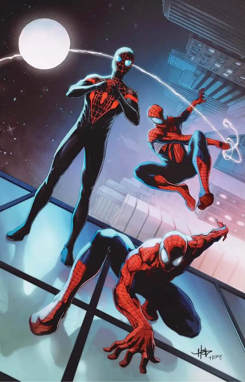 The image shows three Spider-Man characters in dynamic poses against a cityscape at night under a large moon. One stands…