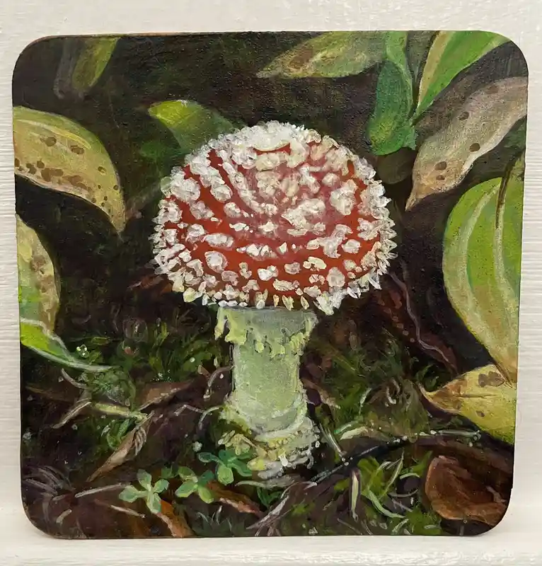 A painting of a red mushroom with white spots, surrounded by green foliage, with the overlaid text 'i'm not a mushroom i'm a…