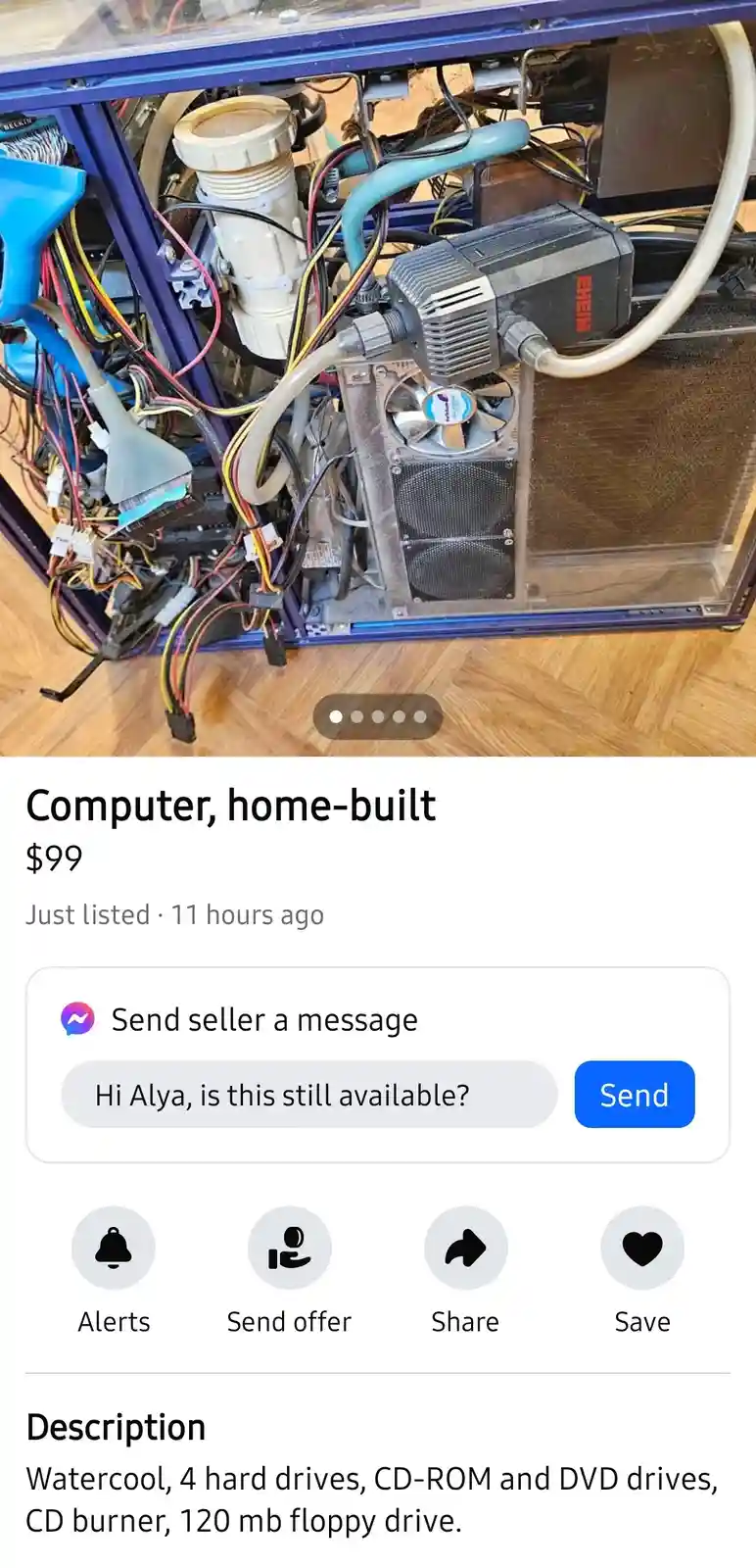 An image of a messy, custom-built computer with visible watercooling pipes, fans, and tangled wires is displayed as a…