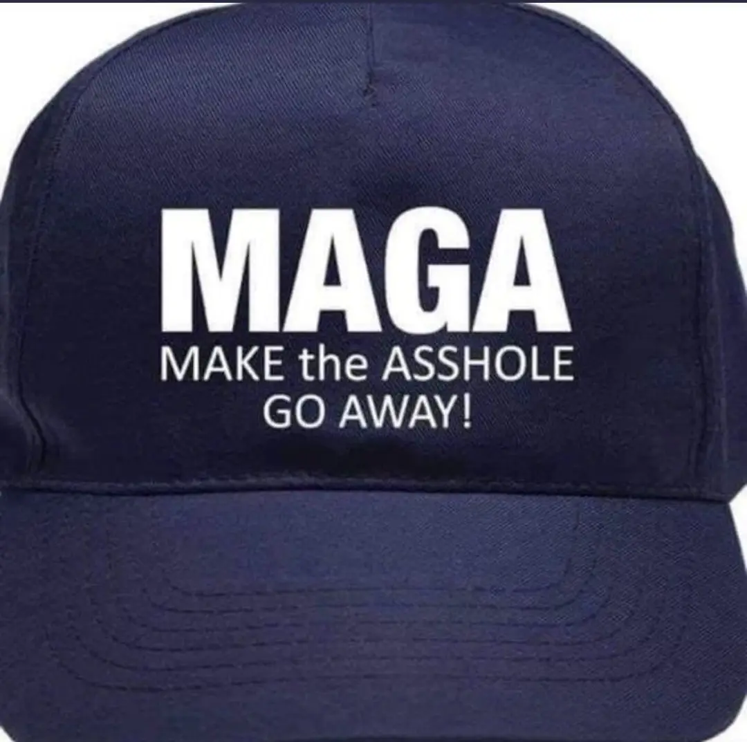 A close-up of a dark blue baseball cap with white text that reads 'MAGA' in large letters, followed by 'MAKE the ASSHOLE GO…