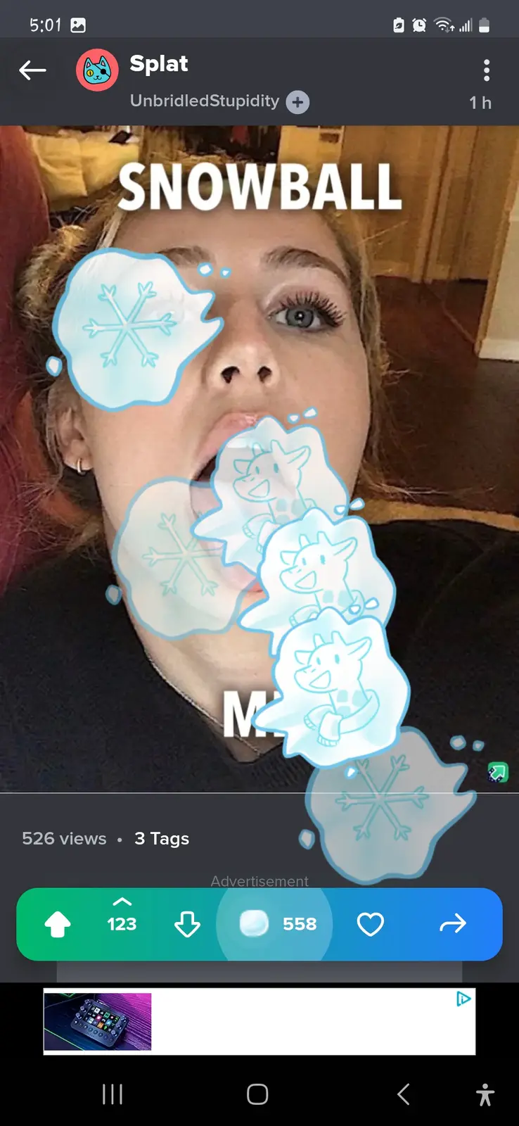 A selfie of a woman with her mouth open, overlaid with cartoon snowflakes and snowballs featuring a giraffe character. The…