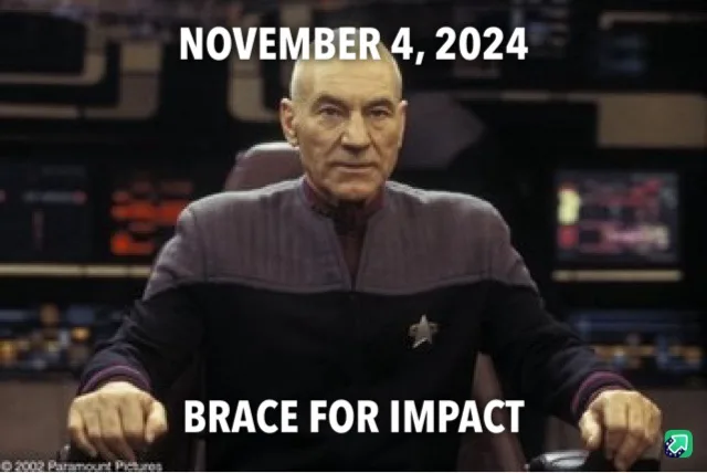 A still image of Captain Picard from Star Trek: The Next Generation, seated at a command chair in a spaceship bridge…