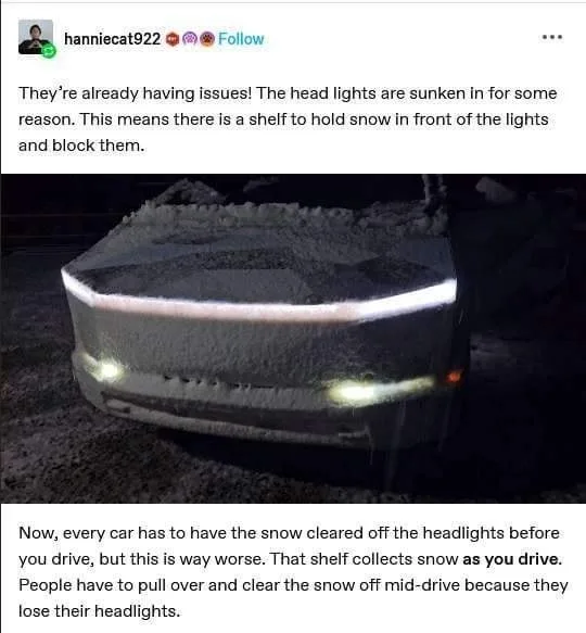 A car's front end is covered in snow, with a distinct raised shelf above the headlights that is holding snow and blocking…