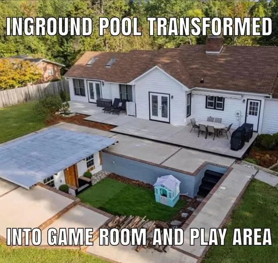 An aerial view of a suburban house with a large, rectangular in-ground pool area that has been completely covered over with…
