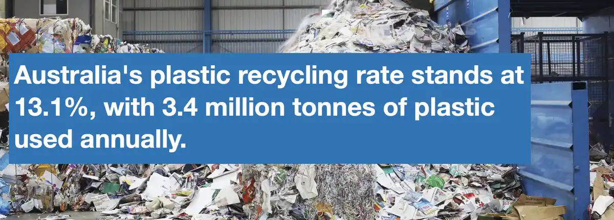 The image shows a large industrial recycling facility filled with piles of shredded paper and other recyclable materials. A…
