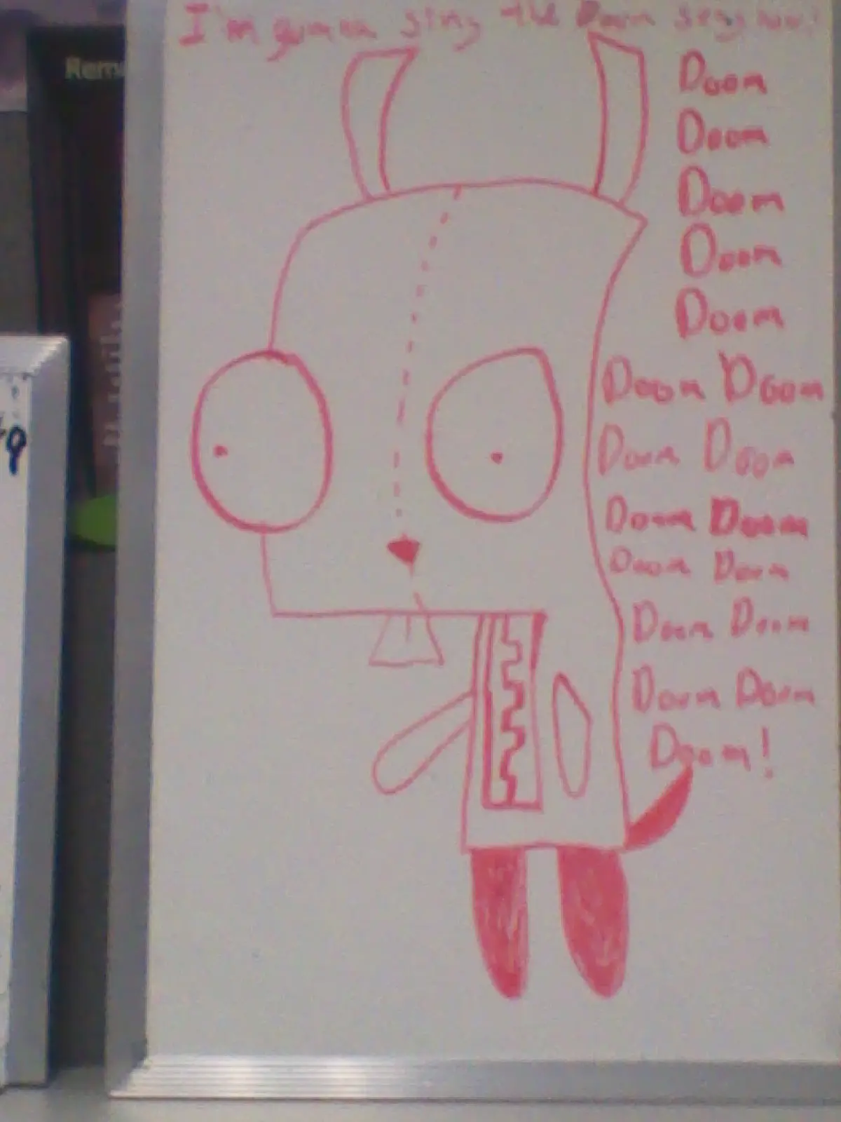 A hand-drawn cartoon character in pink marker on a whiteboard, with large eyes and a simple body. The text above reads 'I'm…
