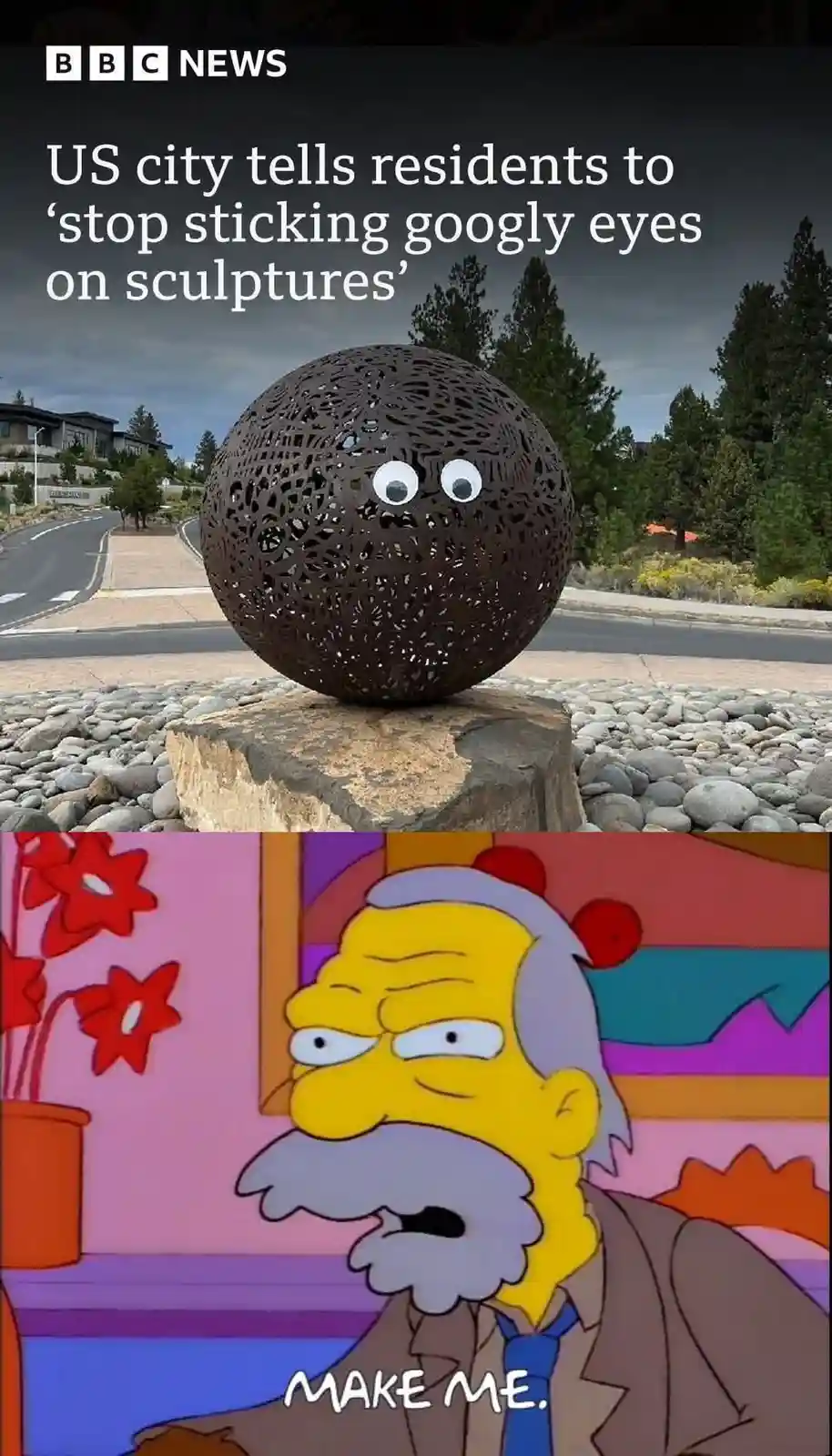 The image shows a spherical metal sculpture with googly eyes stuck onto it, set outdoors on a stone pedestal. The top half…