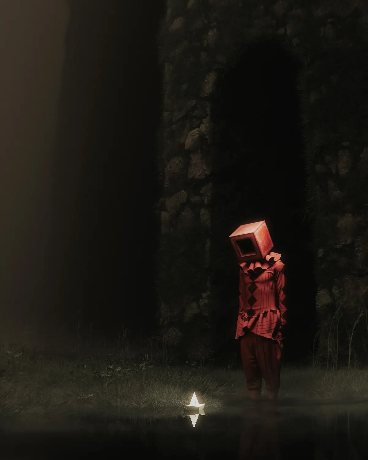 A figure with a red cube head and red diamond-patterned clothing stands in a dark, misty, grassy area near a stone archway…