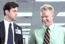 A six-frame sequence shows two men in office attire. The man on the left remains stoic and unchanging, while the man on the…