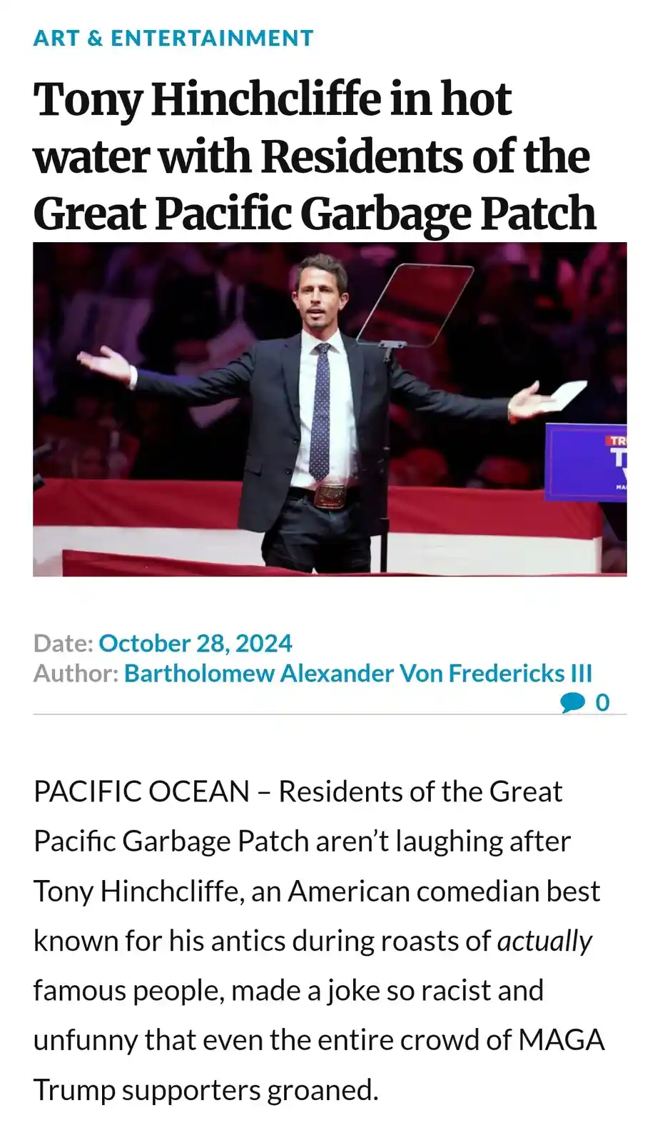 A satirical news article screenshot shows comedian Tony Hinchcliffe on stage with arms outstretched, wearing a suit and tie…