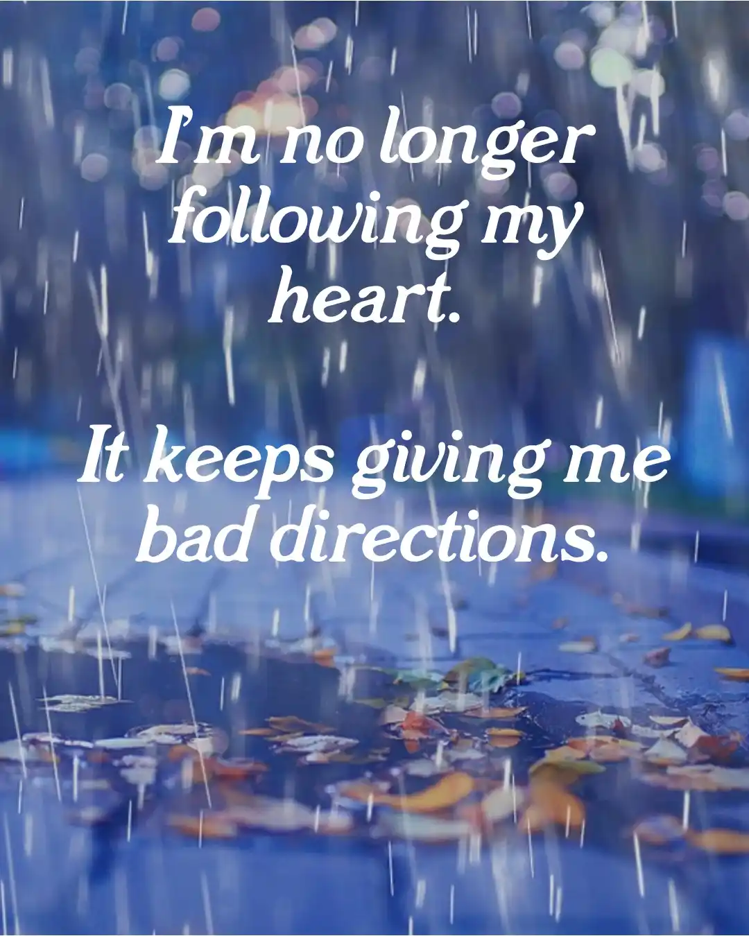A rainy scene with blurred lights and fallen leaves on wet pavement, overlaid with white text stating 'I'm no longer…