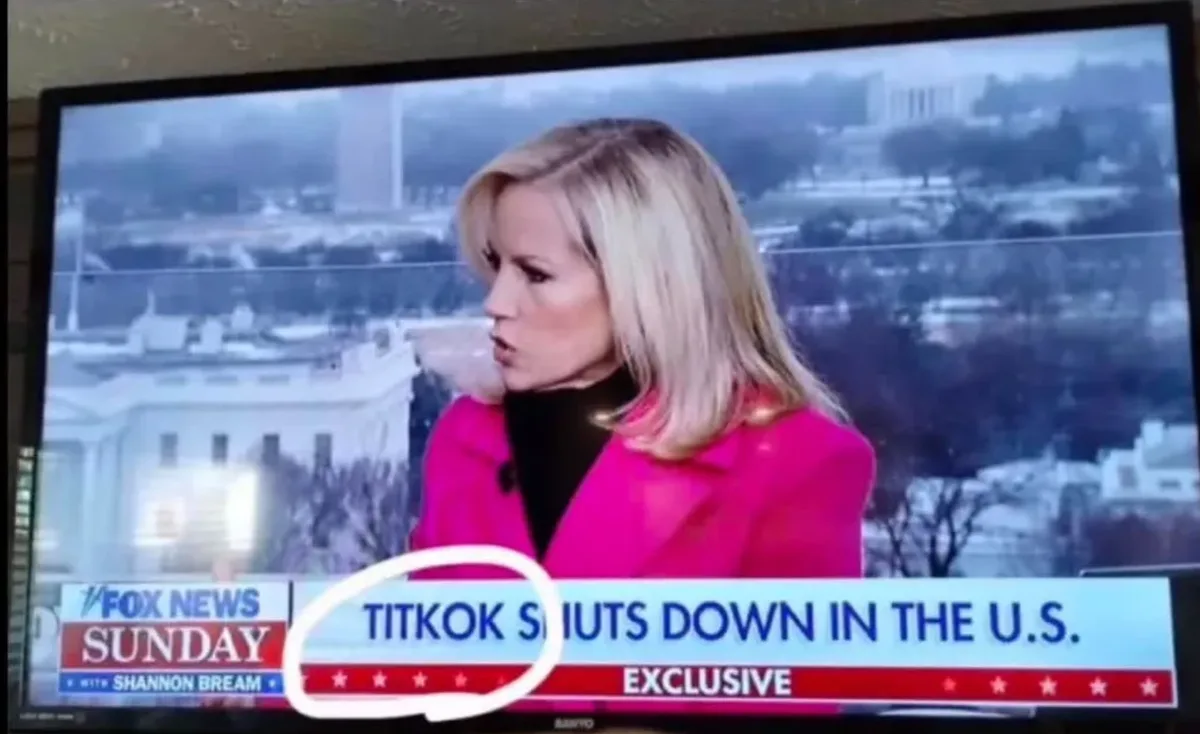A television screen shows a news broadcast from Fox News Sunday with anchor Shannon Bream. She is wearing a bright pink coat…