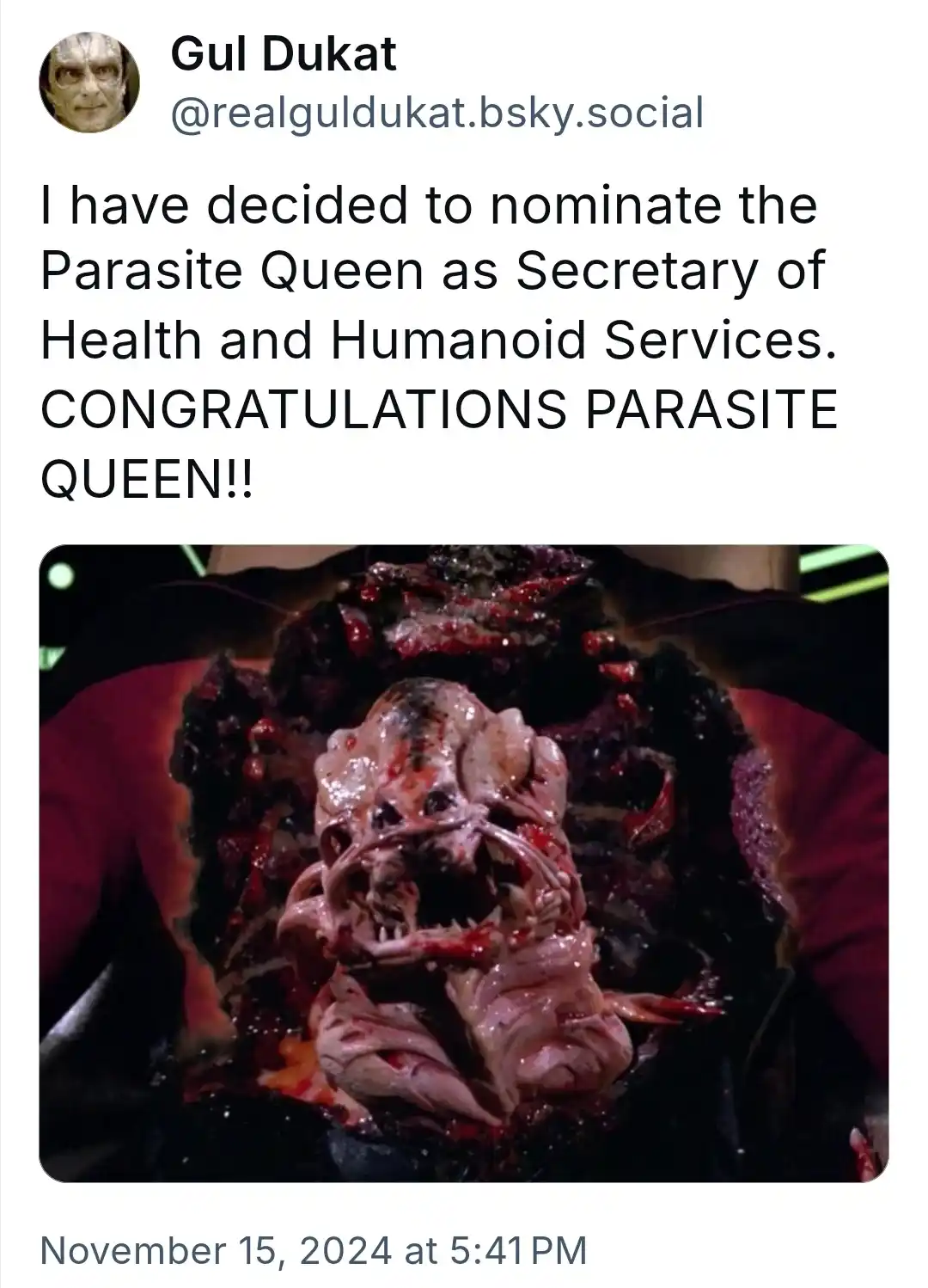 A screenshot of a social media post by 'Gul Dukat' featuring a grotesque, fleshy alien parasite emerging from a human host's…