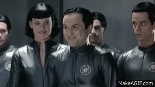 A six-frame GIF from the TV show 'Star Trek: The Next Generation' shows a man in a black uniform progressively screaming…