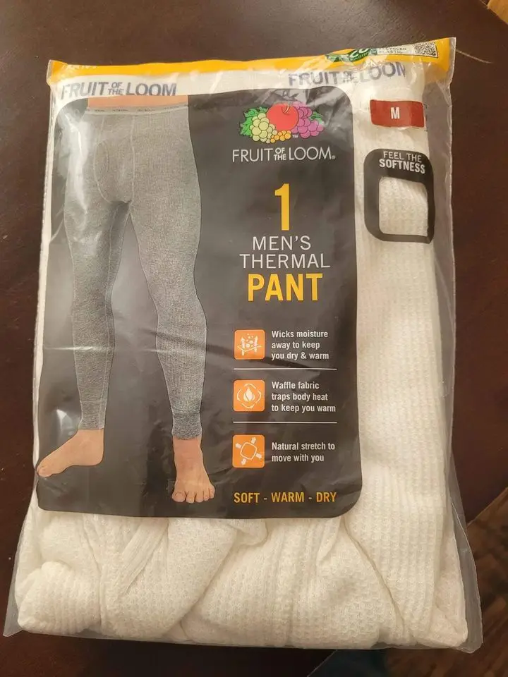A package of Fruit of the Loom men's thermal pants, size medium, shows a gray thermal pant on a model and a white…