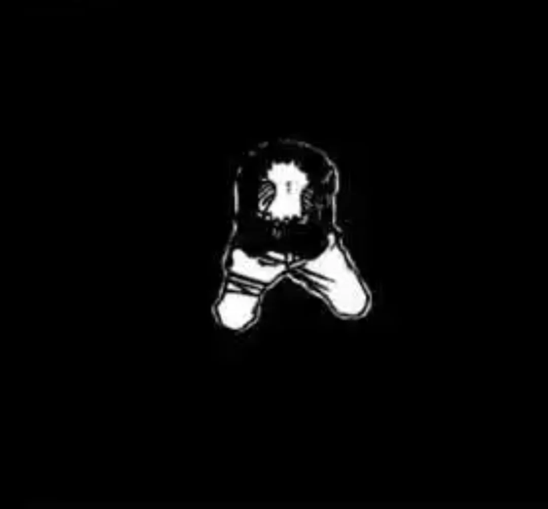 A black-and-white image shows a stylized, cartoonish figure with a round head and simple facial features, sitting…