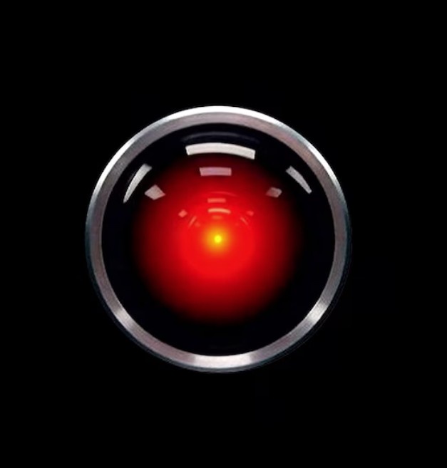 A close-up of the iconic red glowing eye of the Terminator's endoskeleton, set against a black background, with the overlaid…