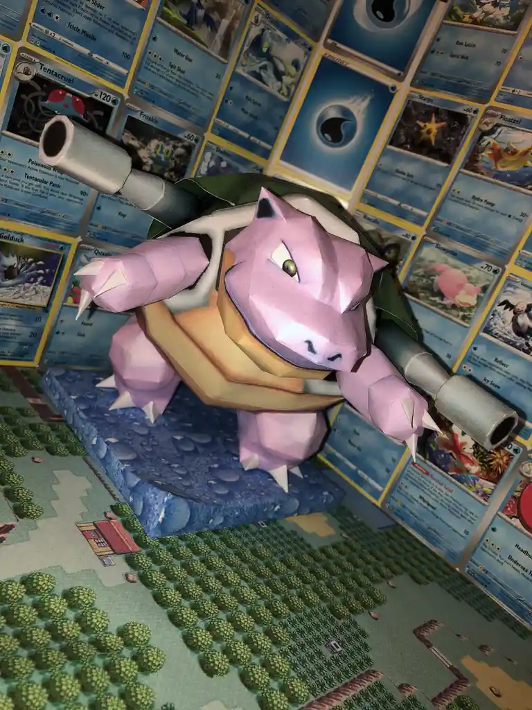 A papercraft model of the Pokémon Blastoise, modified with two large tank cannons instead of its usual water cannons, stands…