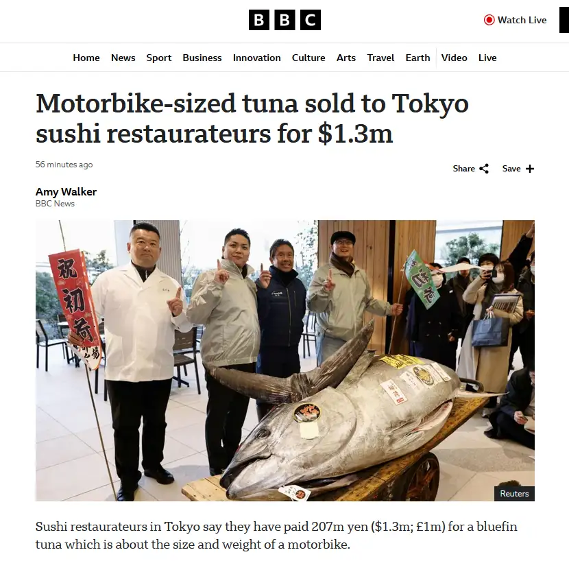 A BBC news article screenshot shows several people posing beside an enormous bluefin tuna on a wooden cart, with the…
