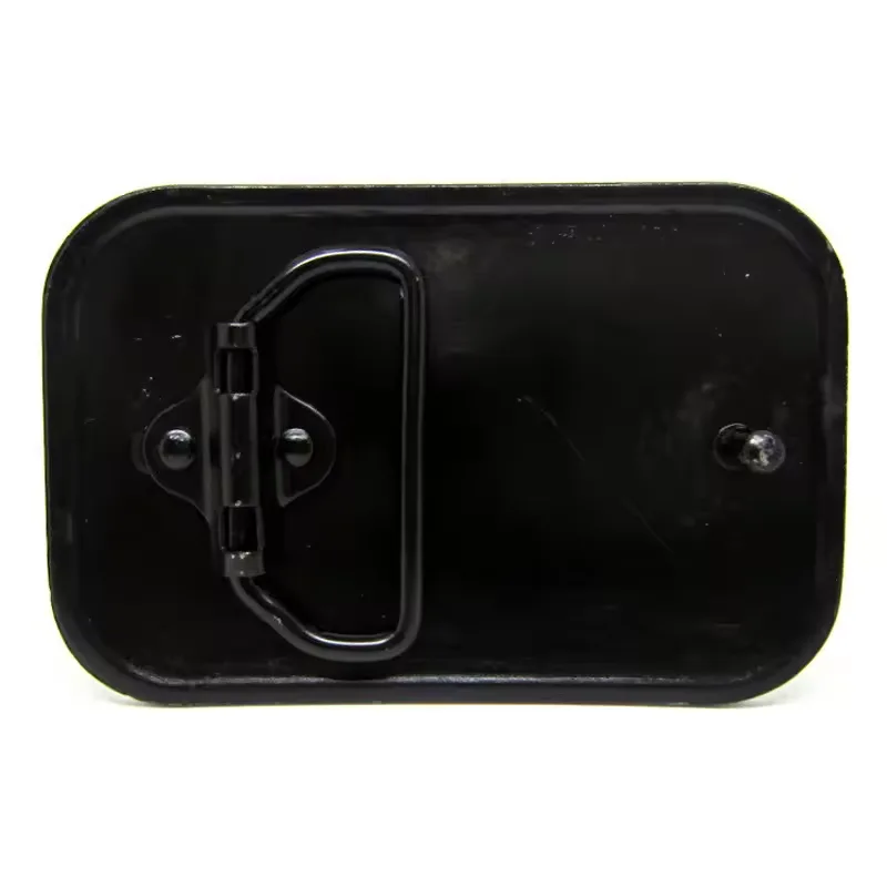 A close-up of the underside of a black metal can lid, showing a hinge mechanism and a single screw on the right side, with…