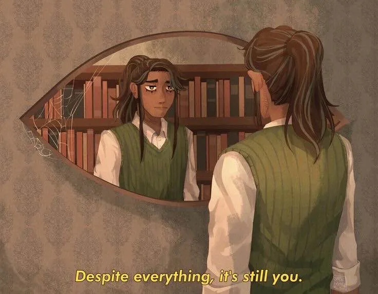 A person with brown hair in a ponytail, wearing a green vest over a white shirt, stands before a dusty, oval mirror with a…