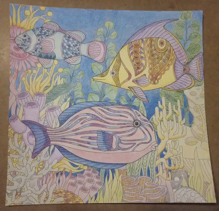 A hand-colored underwater scene featuring three stylized fish with intricate patterns swimming among coral and seaweed…