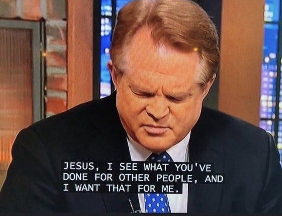 A man in a suit and tie, looking down with a pained or pleading expression, has white text overlaid on his chest that reads…